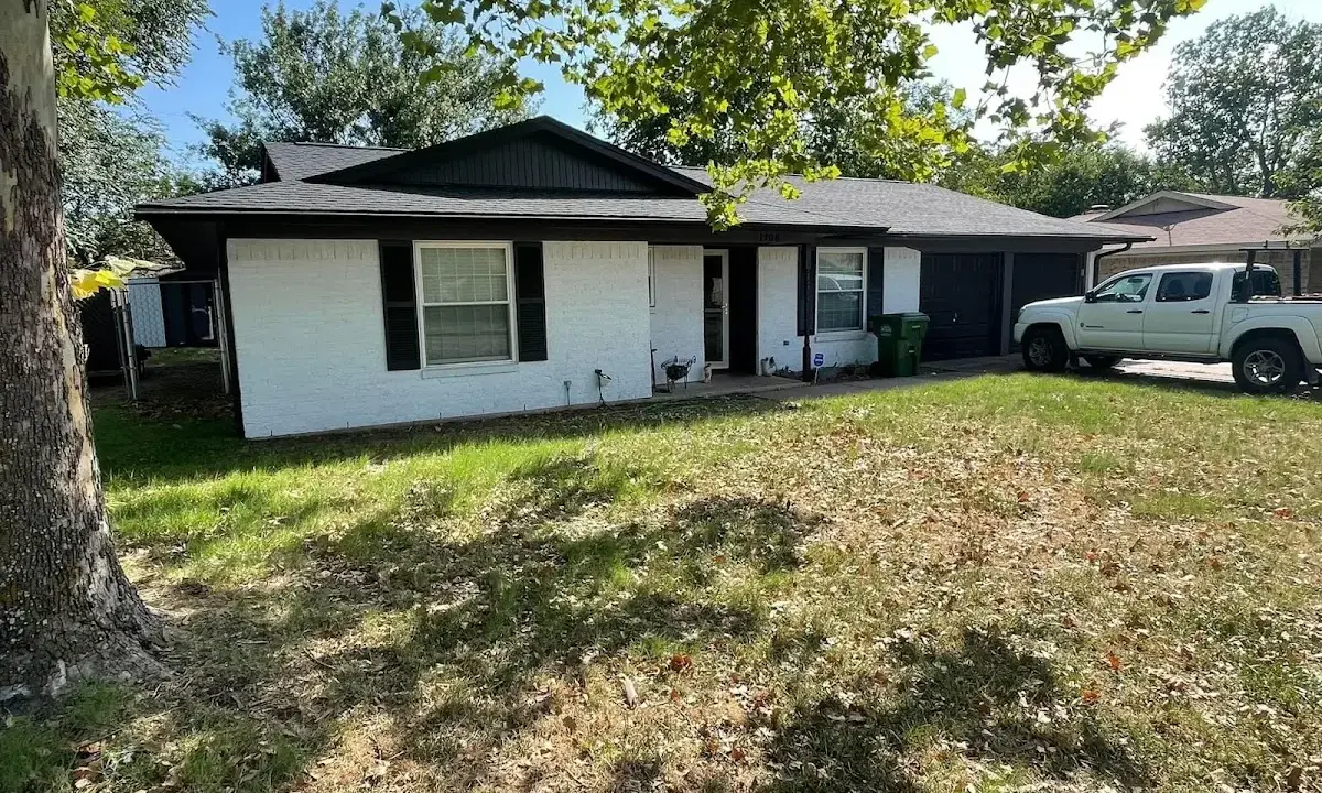 Professional roofing crew working on a residential roof in Lititz
